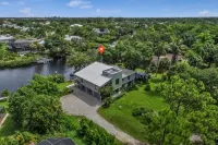 Luxe Riverfront Home on 1-Acre Lot w/ Private Dock, Hot Tub & Screened Deck Hotel di Bonita Springs