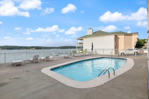 Lovely lakeside condo with pool, tennis court, fireplace, & washer/dryer