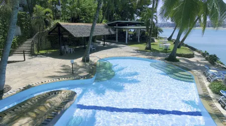 Tamarind Village Hotel Apartments Отели рядом с достопримечательностью «Найали Бич»