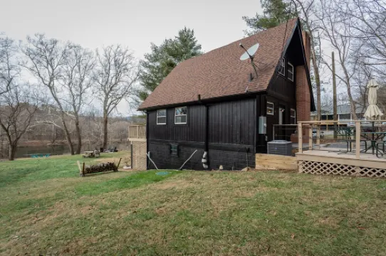 Modern Riverfront A-Frame Cabin w/ Hot Tub, Fire Pit, Kayaks, Canoe, & Arcade