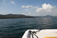 Independent villa with private beach on the lake