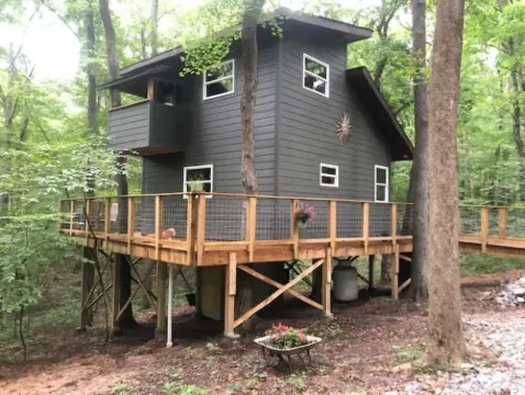 Secluded treehouse with indoor fireplace