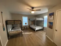 Spacious Modern Lake Retreat w/ Deck! Only a short Walk to Swimming and Fishing!