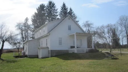 Stay in an authentic 1823 post-and-beam framed Federal style rural farmhouse.