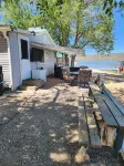 Charming 2 Bedroom Waterfront Cabin at West Magic Id. 83352 with Hot Tub.
