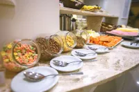 CLH Suites Domingos Ferreira - Desayuno