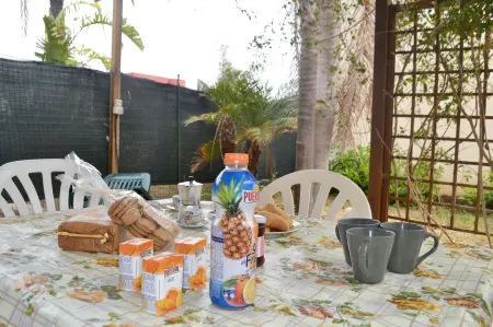 Charming Home on the Beach with Spacious Terraces & Garden; Pets Allowed;