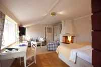 Tällbergsgårdens Hotell فنادق في ليكساند