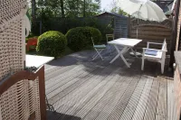 Apartment with private wooden terrace and beach chair