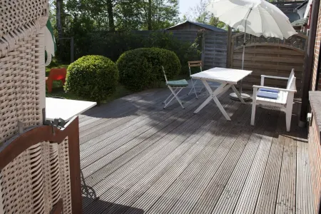 Apartment with private wooden terrace and beach chair