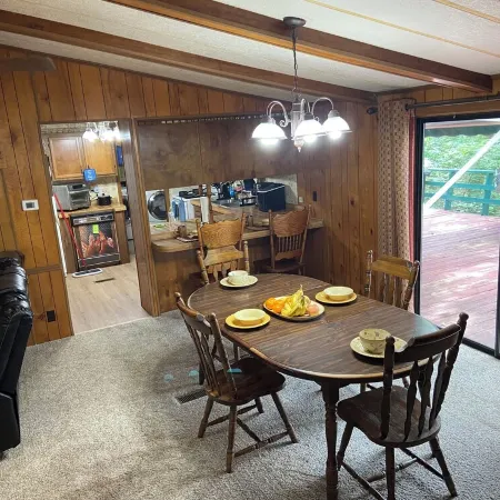 Quiet cabin in the woods w/ access to pools, river, & lakes in gated community!!