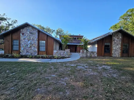 Charming private 4-bedroom estate on over 1 acre of land.