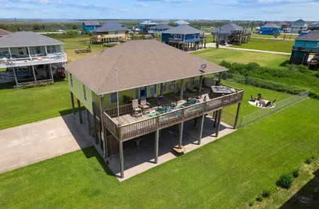 This 3 bedroom beach house is the PERFECT space to get “A Wave From It All
