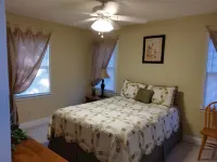 The Lake House at Turtle Cove: Cozy relaxing lake home with dock on wooded lot.