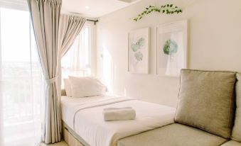 Simple and Cozy Living Studio Room at Poris 88 Apartment