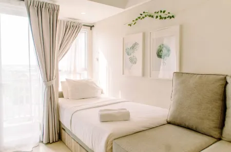 Simple and Cozy Living Studio Room at Poris 88 Apartment