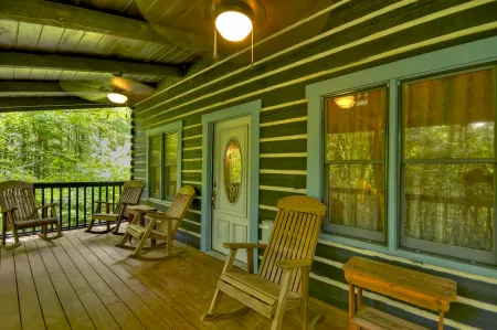 Cozy Cabin with Rock Fireplace and Lush Surroundings - Charming Rustic Haven