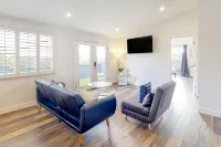 Breezy dog-friendly house with hot tub, central AC, game room, & washer/dryer