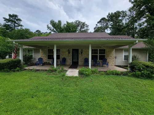 Ranch house surrounded by peace and quiet in the tall pines.