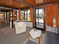 Wooden Chalet with Terrace Near Swimming Lake