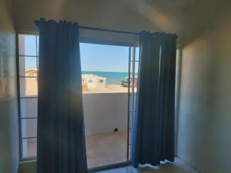 Rica's Point Beach & Dunes House Отели рядом с достопримечательностью «Плайя Сан Фелипе»