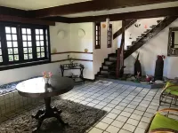 Cozy and charming house with pool and gardens in sea front condominium!