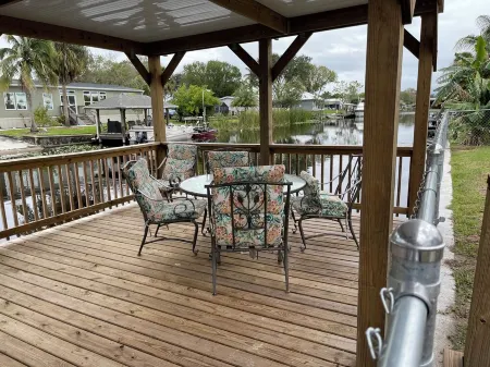 Waterfront, indoor pool, covered marina, fenced 3/2 home