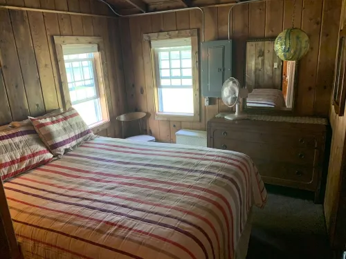 Torch Lake Village Cozy Cottage with private dock