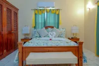 Two bedroom, 2 bathroom house in a tropical palm and garden setting.