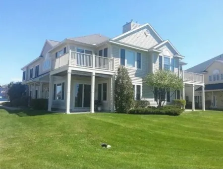 Waterfront condo with beach steps to Boyne City