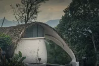 Cozy 2-bedroom cabin in Wayanad, built sustainably amidst lush greener