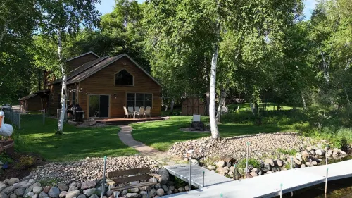 Spacious Summer Escape: Private Backyard, Dock & Fire Pit, Channel Waterfront