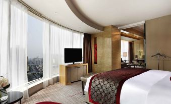 elegant desk and chair, creating a comfortable and stylish space for guests to relax and work at Sofitel Guangzhou Sunrich