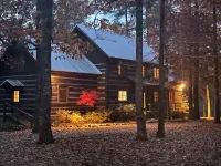 Prospect Mountain Cabin custom log home sportsman's paradise with fishing lake.