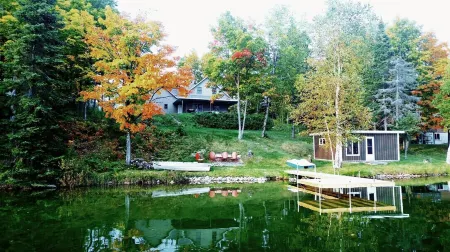 Beautiful newer home on the sunny side of peaceful Camp Lake in Iron River