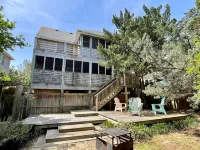 Charming Island Escape with Screened Porches and Spacious Yard - Inviting Retreat