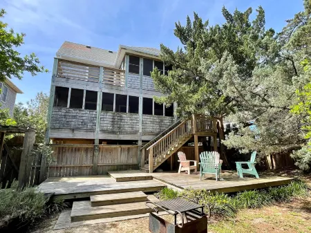 Charming Island Retreat with Spacious Yard and Screened Porches - Inviting Oasis