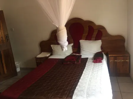 Kana Guest House Отели в г. Simonga