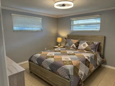 This cozy house comes with 3 bedrooms, 2 baths and a private swimming pool. Hotels near Ridge Road Shopping Center