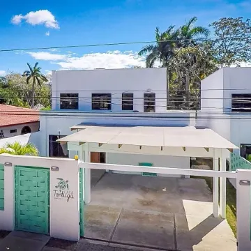 Ultramodern Townhome with an Inviting Coastal Design and Lush Outdoor Oasis with a Private Pool