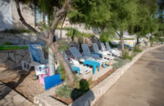 Villa Vedran apartment Vedran B with sun beds facing the sea