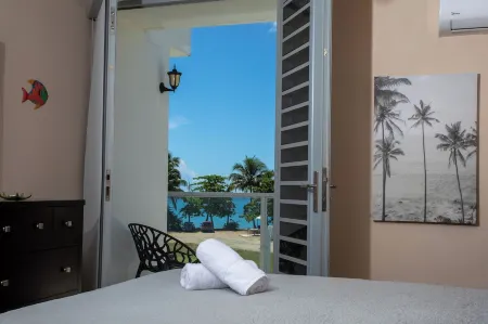 Beachfront in gated community with patio,  balcony, pool, close to all in Rincón Отели в г. Пунтас