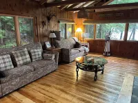 Welcoming 4-bedroom lake front cabin in charming Otis on Beech Hill Pond.
