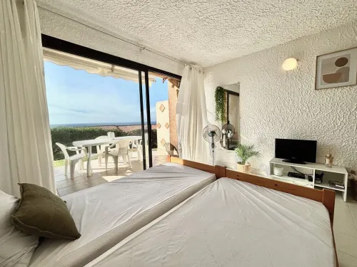 Garden level apartment with sea view