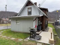 Cozy 2-bedroom cabin in Gilbert. Located close to RockHouse and Devil Anse Trail