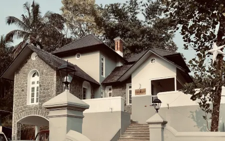 "Thalimala Bungalow, Experience A Vintage Colonial Charm in a Tea-Scaped Haven"