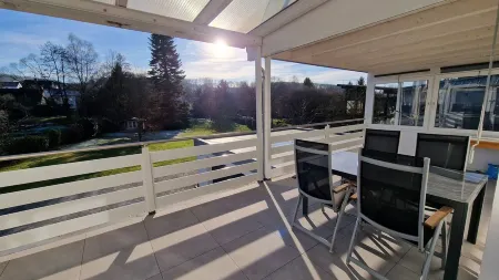 Modern, newly built vacation apartment with large covered balcony and view