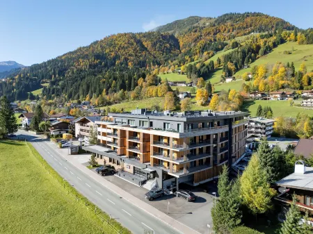 AlpenParks Taxacher Hotel & Apartment Отели в г. Кирхберг