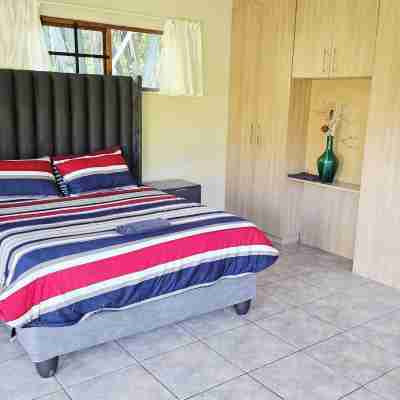 Serene 1-Bedroom Apartment with Garden & Shared Pool Rooms