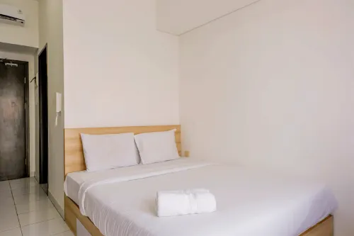 Homey Studio at Casa de Parco Apartment by Travelio